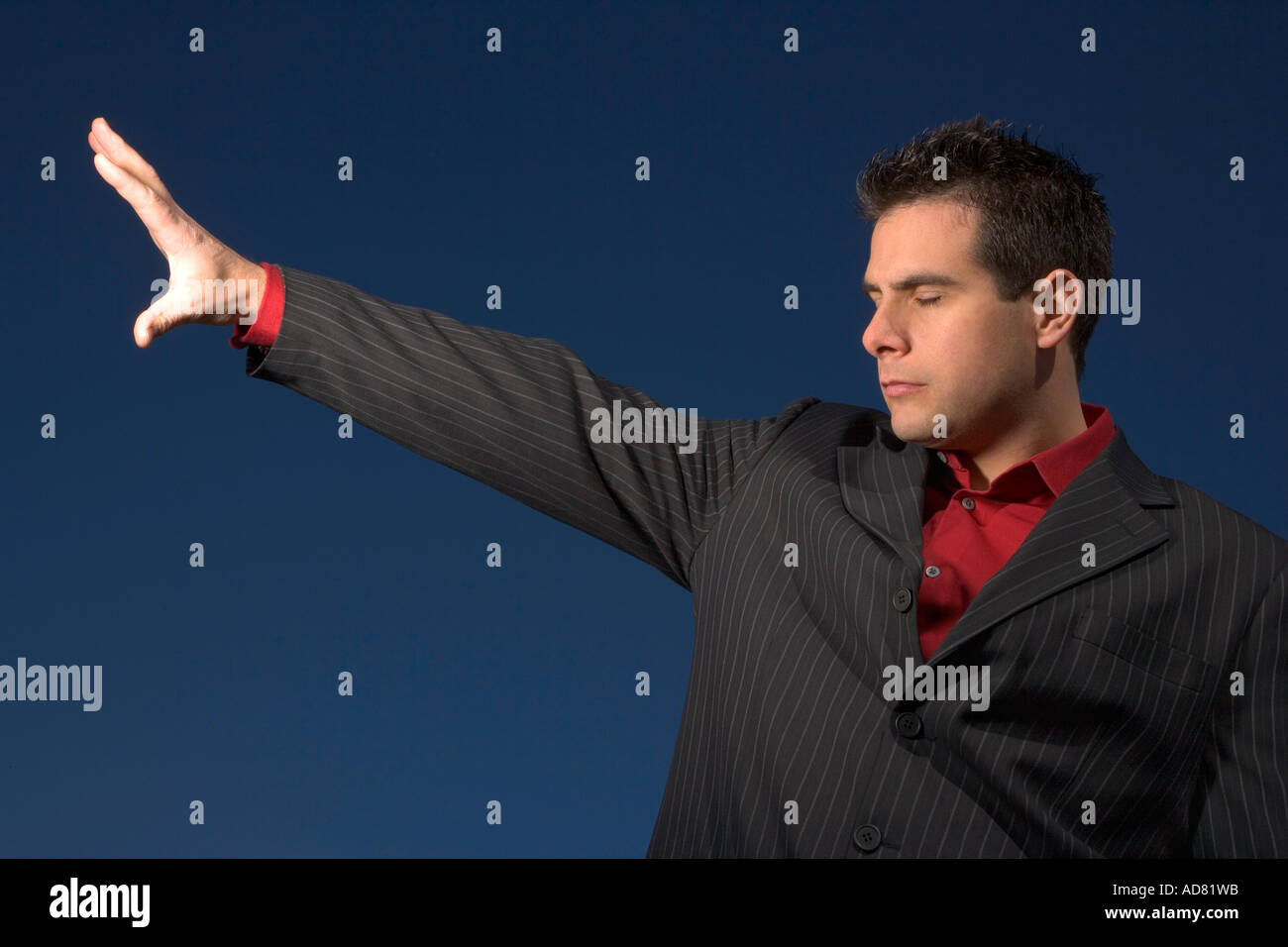 Man with arm outstretched Stock Photo