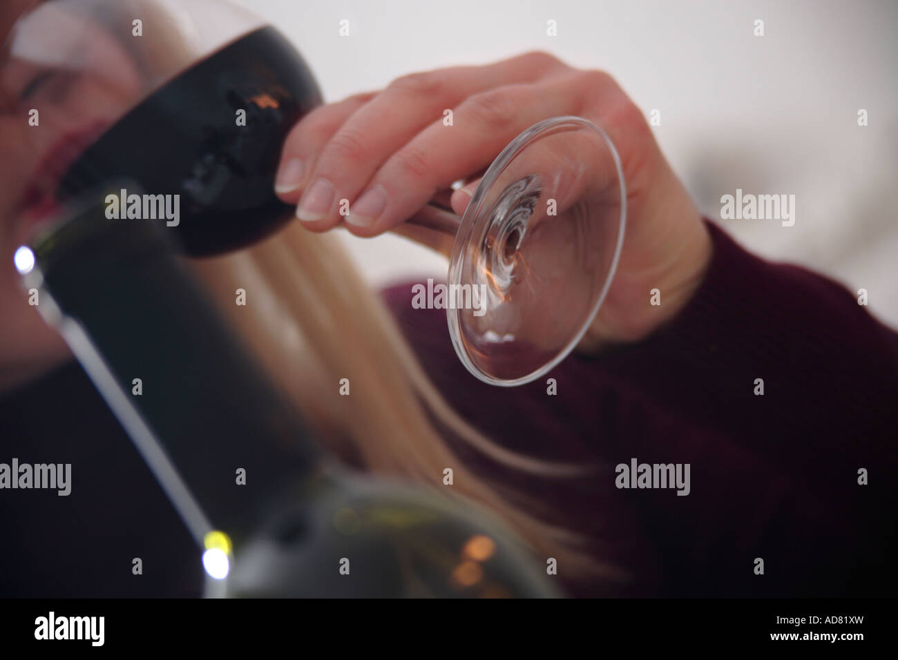 Woman drinking red wine, close up Stock Photo - Alamy