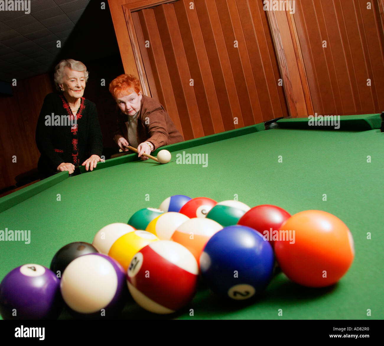 Seniors playing pool Stock Photo