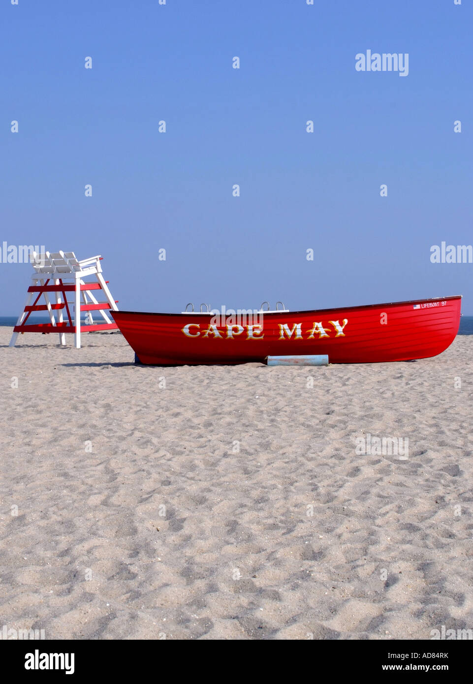 Bright Red Lifeboat and Empty Lifeguards Raised Chair on Beach at Cape ...