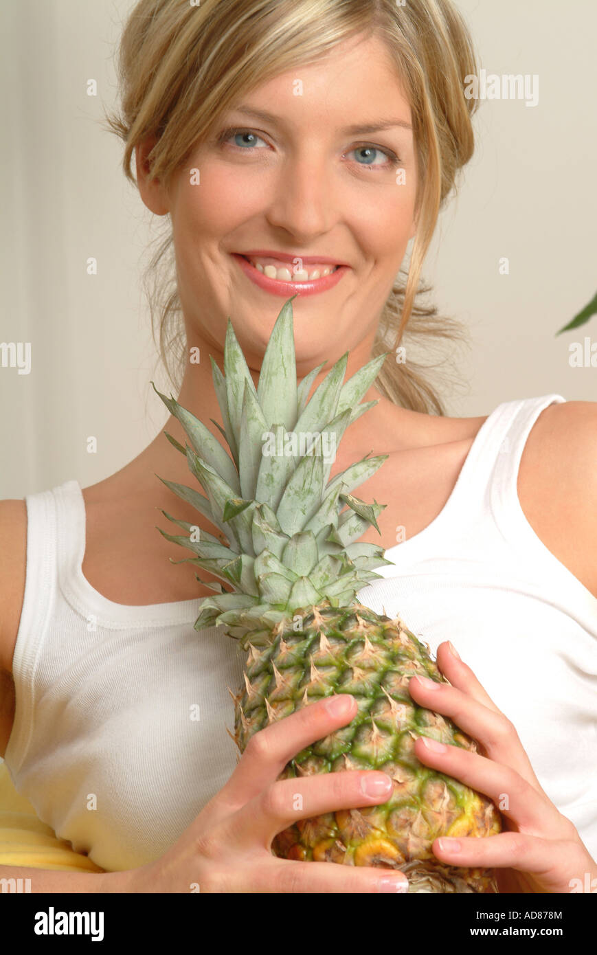 Woman with pineapple Stock Photo Alamy