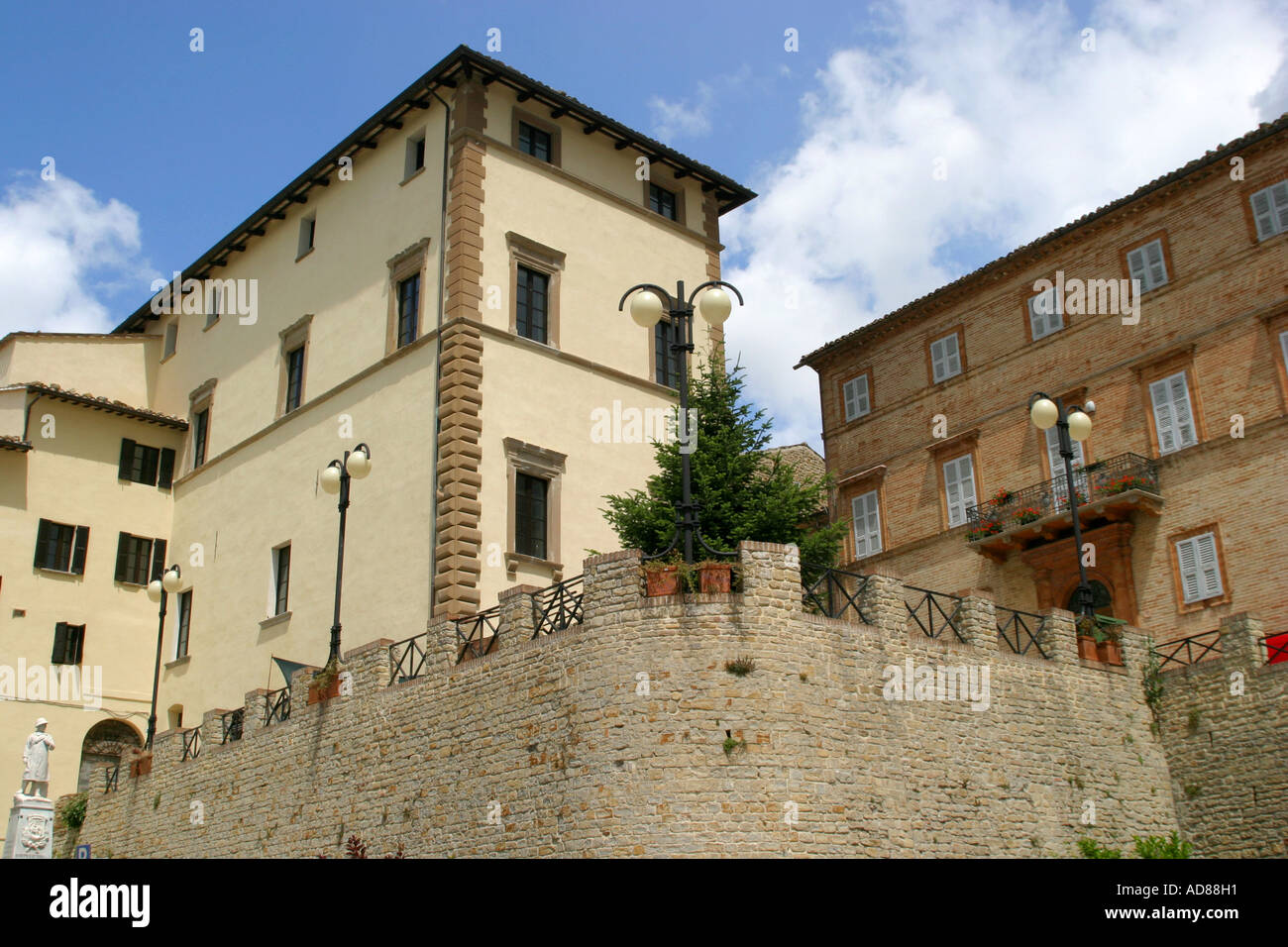 Imposing restored 15th century Palazzo in the main piazza of the charming hilltop town of Monte san Martino in Le Marche Italy Stock Photo