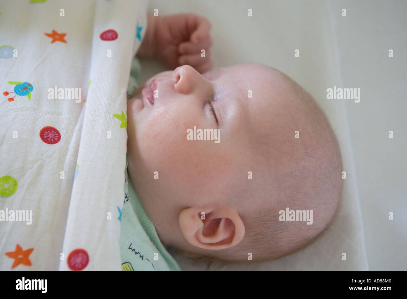 Baby sleeping in a cradle Stock Photo Alamy