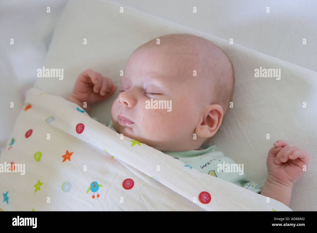 Sleeping baby in cot hi-res stock photography and images - Alamy