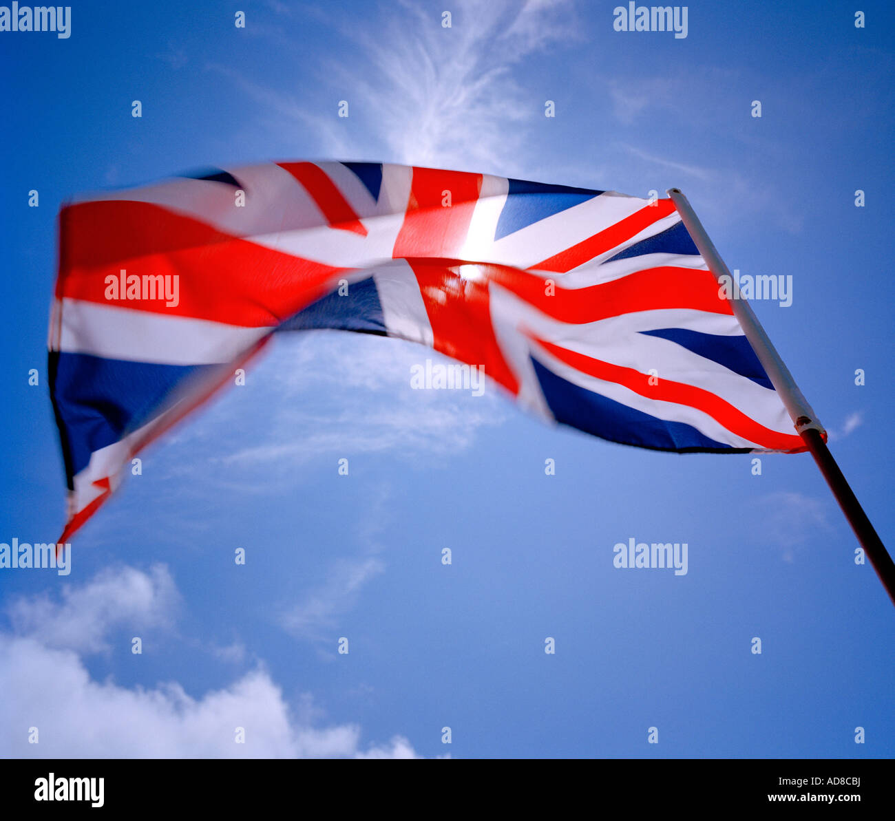 Union Jack fluttering in the wind. Stock Photo