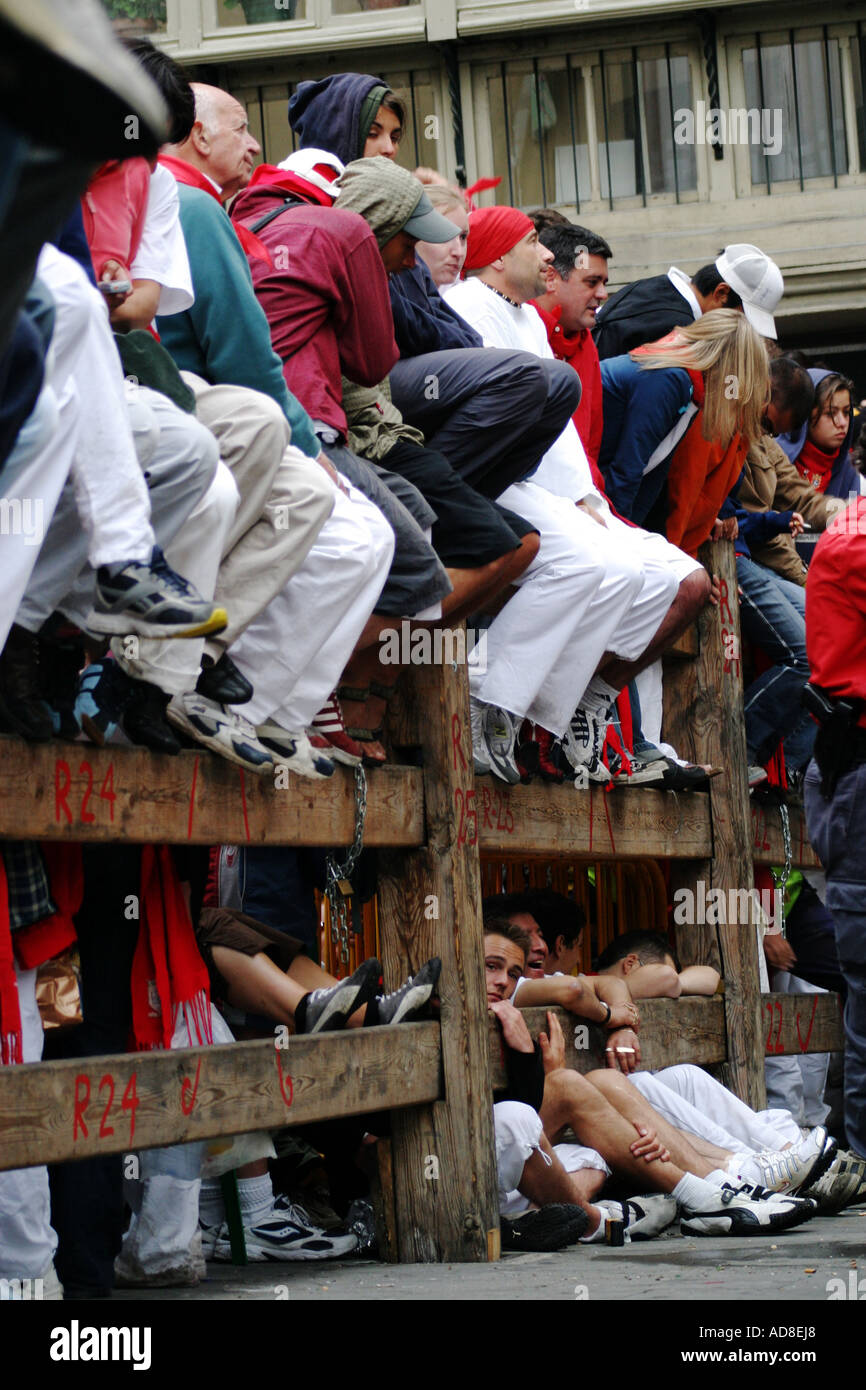 Spectators lining the route  of the Bull Run or encierro held each morning of the San Fermin Festival Pamplona Stock Photo