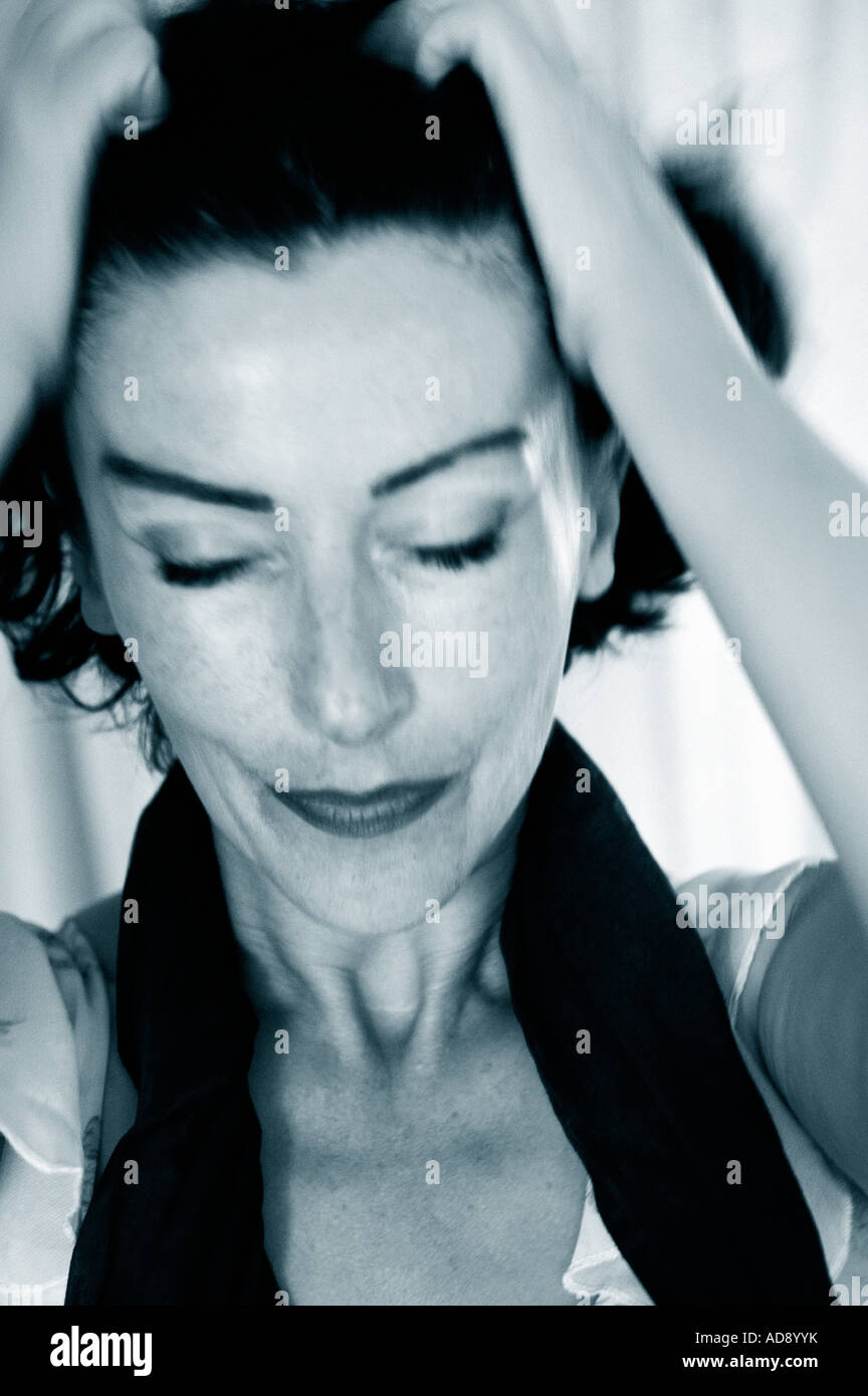 woman pulls her hair in frustration Stock Photo Alamy