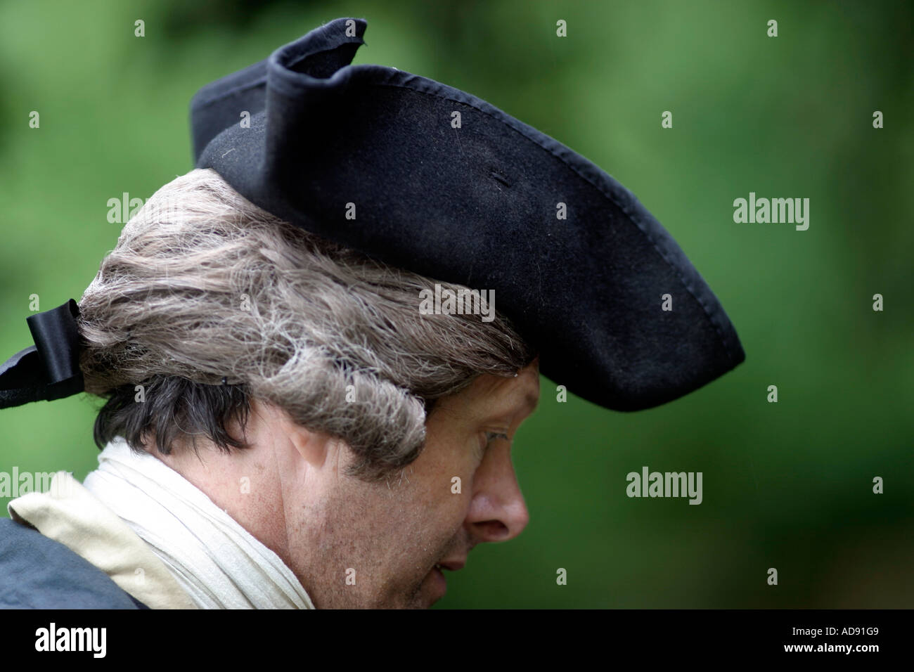 Side view of a man tri corn hat three corner hat and powdered wig Stand