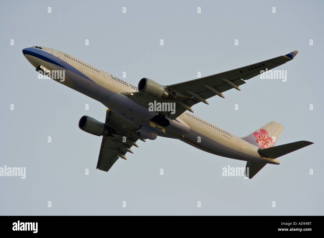China Airlines Airbus A340 Passenger Jet in the Air Just after Takeoff Stock Photo