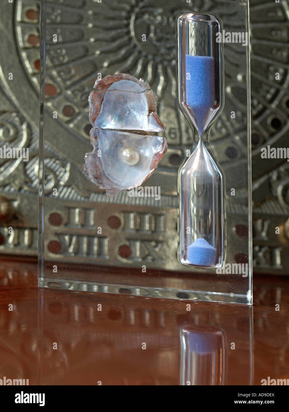 transience of time measuring time with an hour glass with a pearl Stock ...