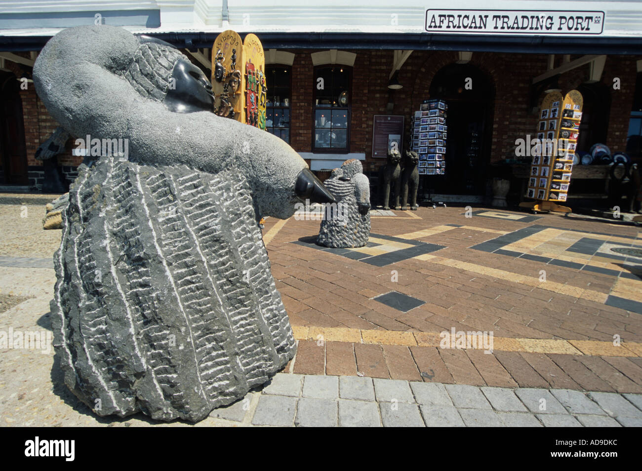 A stone statue stands outside the African Trading Post shop at the ...