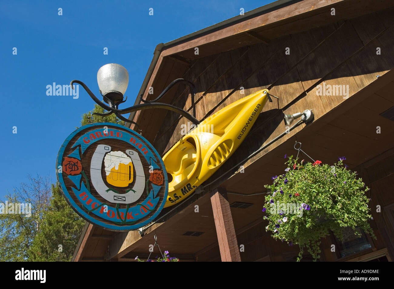 Sign and kayak outside the Garden Bar in Bigfork Montana Stock Photo