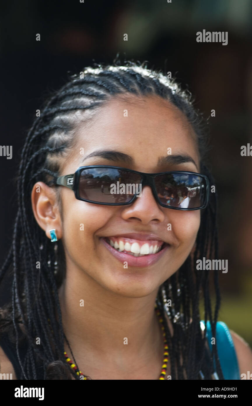 young Australian Aboriginal Islander woman at music festival sunnies ...