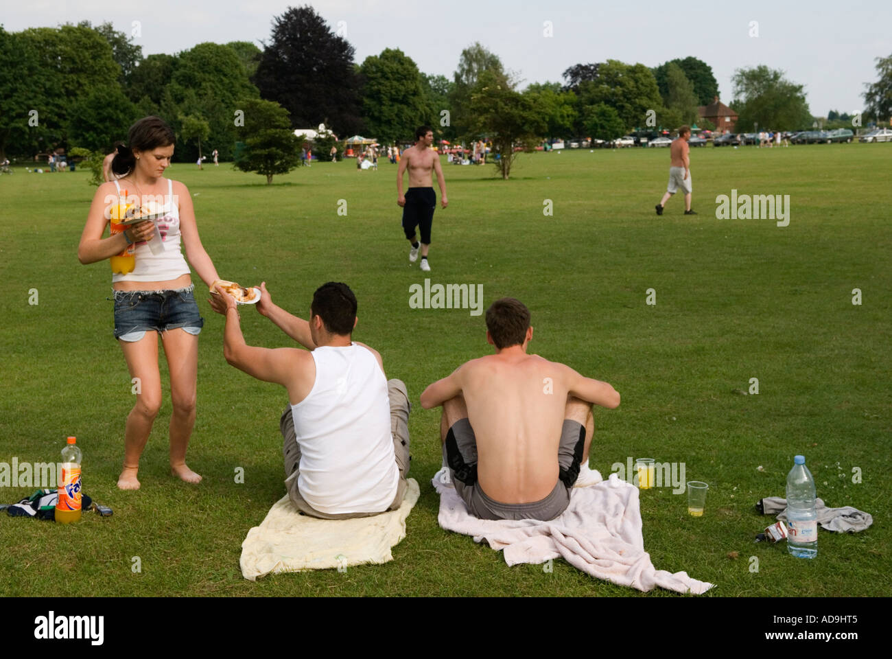 Water Meadow Runnymede. Near Windsor Surrey England 2006 2000s UK.  Young people adults Sunday afternoon messing around together. HOMER SYKES Stock Photo