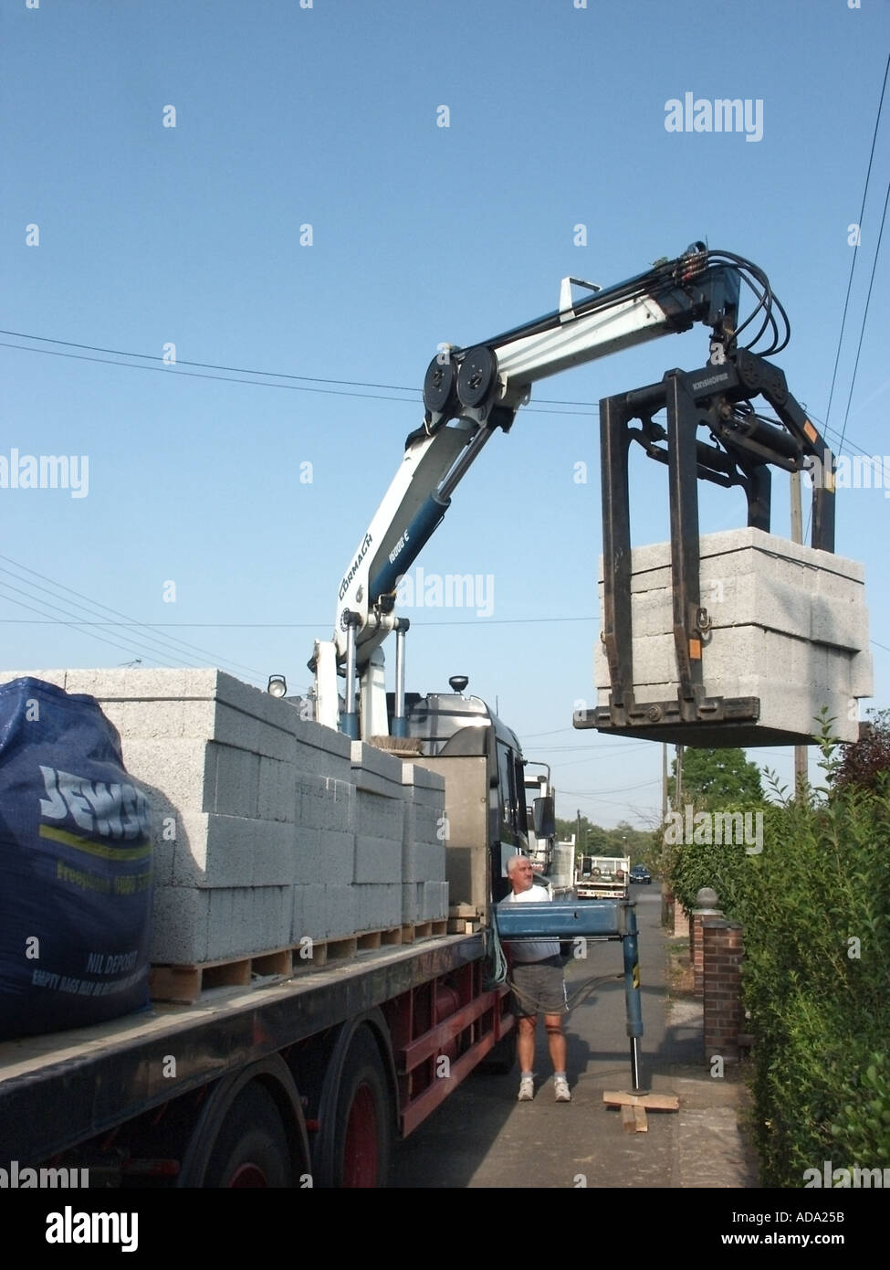 Mechanical unload pallet lorry hires stock photography and images Alamy
