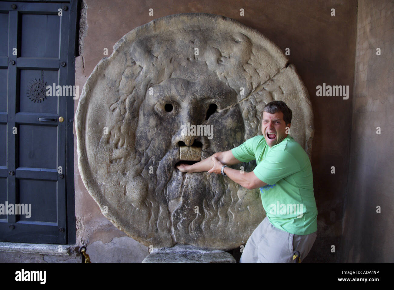 Bocca della Verita man with his hand in the mouth of the sculpture