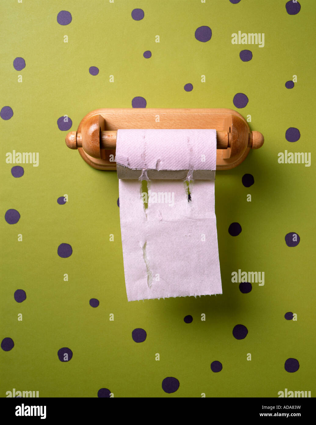 Close-up of toilet paper on green background Stock Photo