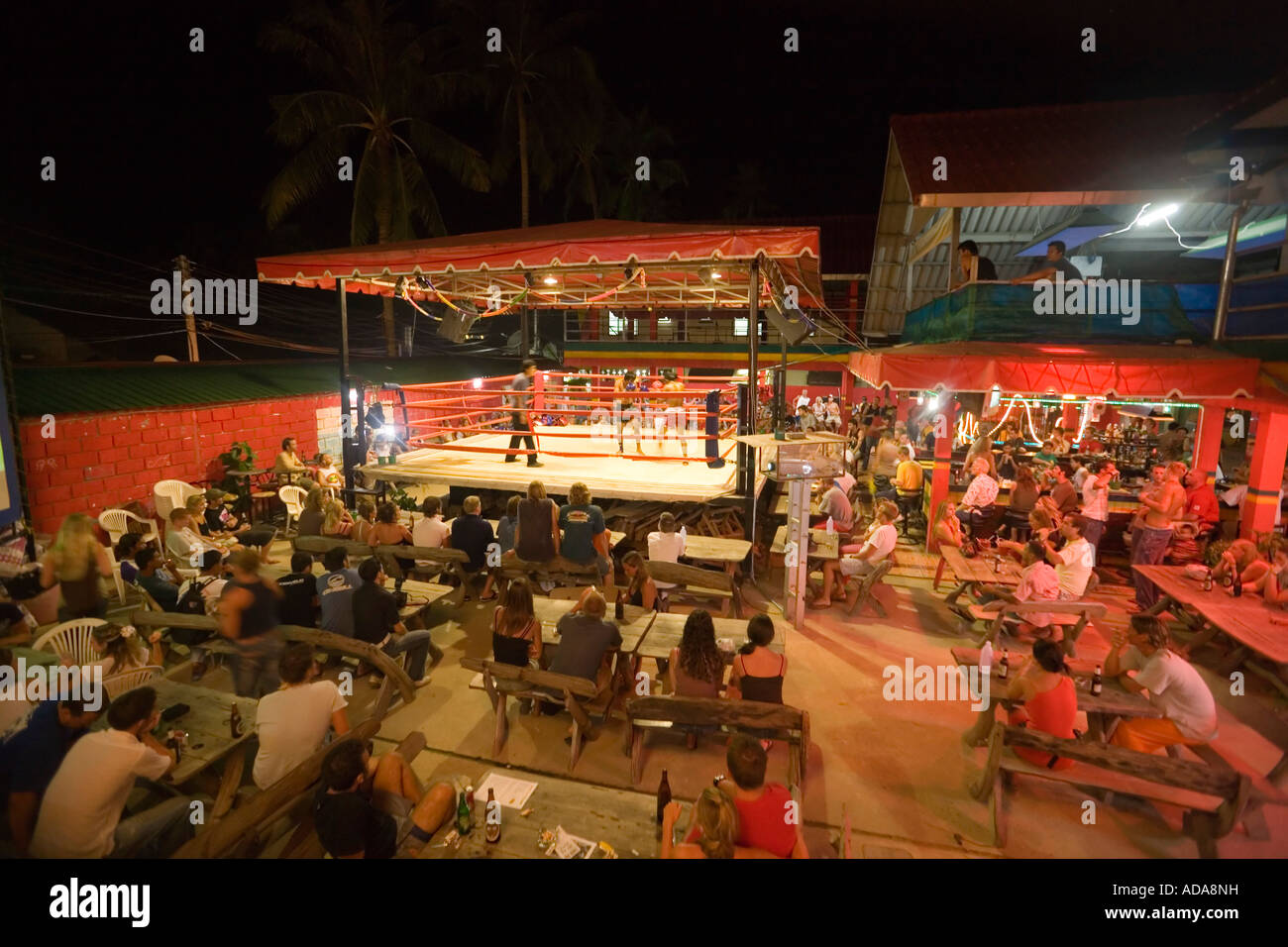 Tourists watching Thai Boxing in the open air area of the Reggae Bar Ko