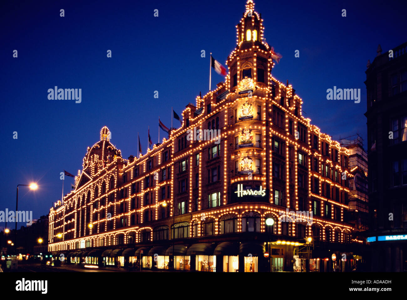 Christmas lights on Facade of Harrod s in Oxford Street London Stock