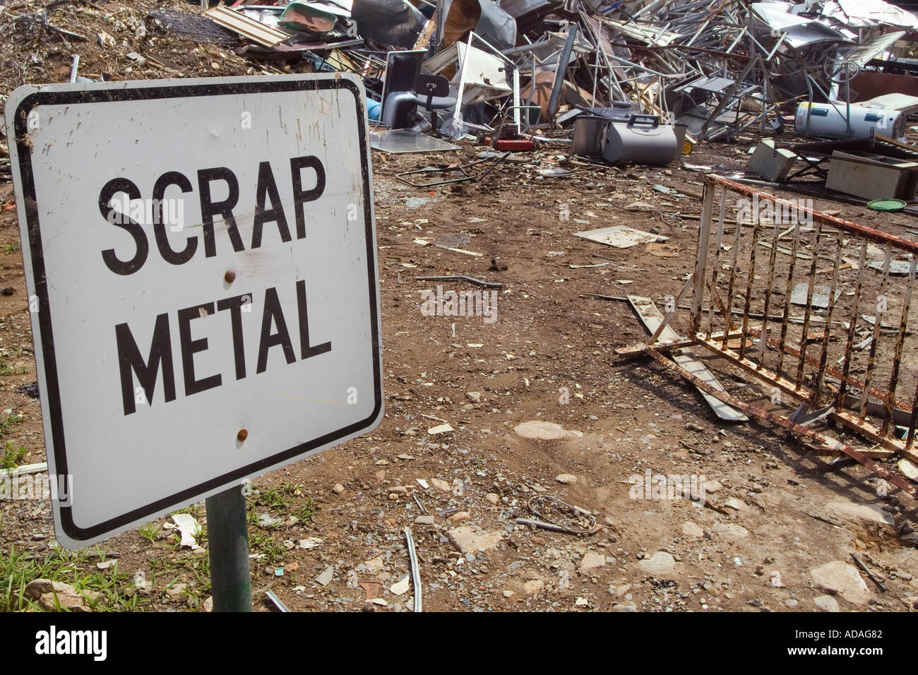Scrap metal pile with sign, at a recycling center Stock Photo - Alamy