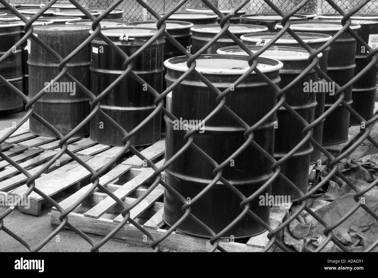 Used oil considered a hazardous waste is kept in large metal drums