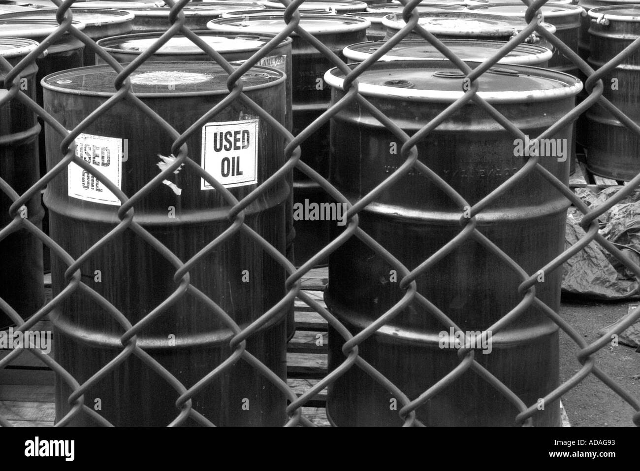 Used oil considered a hazardous waste is kept in large metal drums