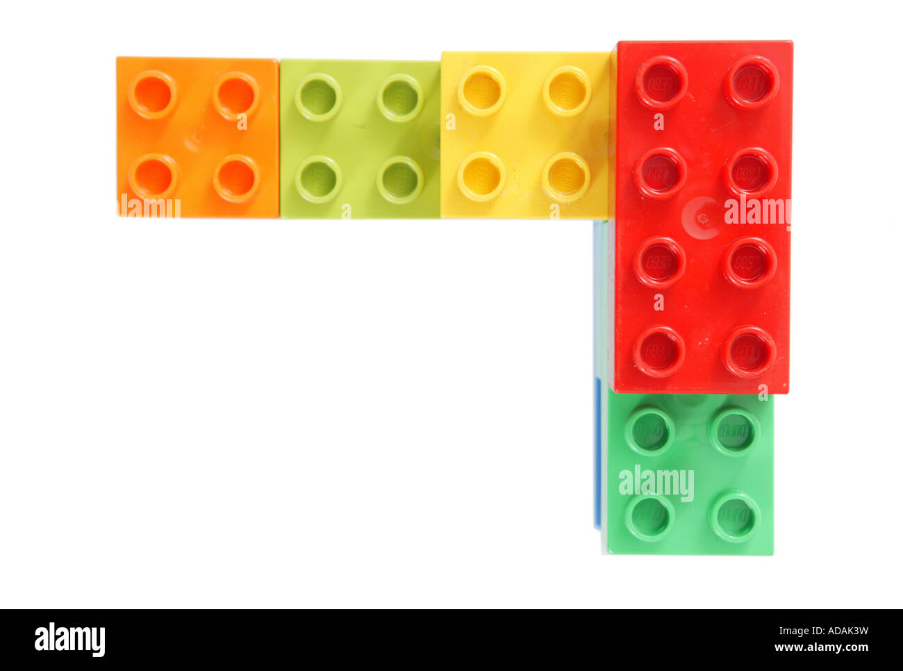 simple corner construction made from childs lego in studio red green yellow orange Stock Photo