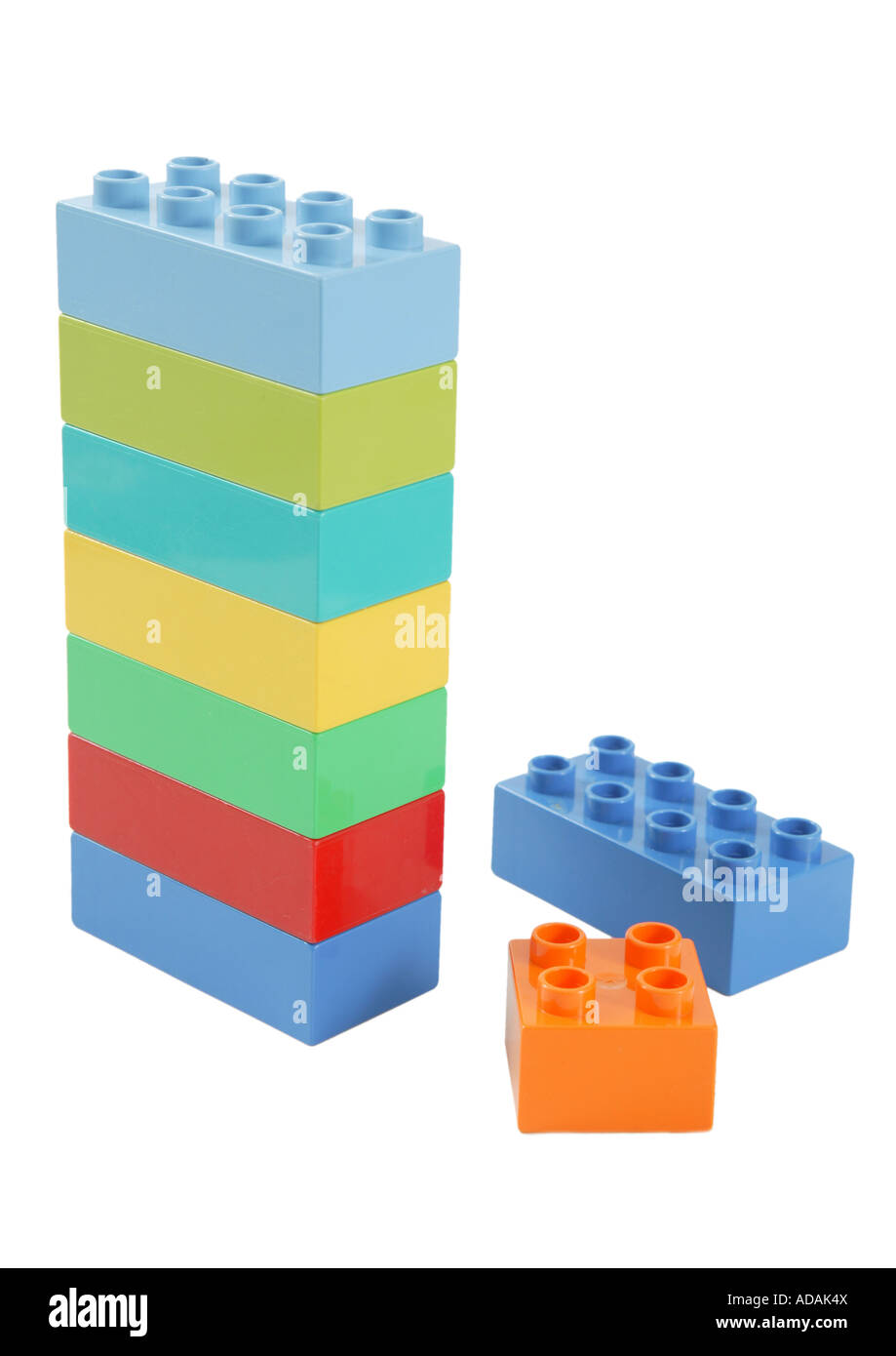 simple upright vertical construction made from childs lego in studio on clean white surface.  blue orange yellow red green Stock Photo