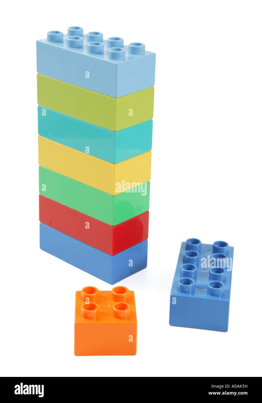 simple upright column construction made from childs lego in studio on clean white surface Stock Photo
