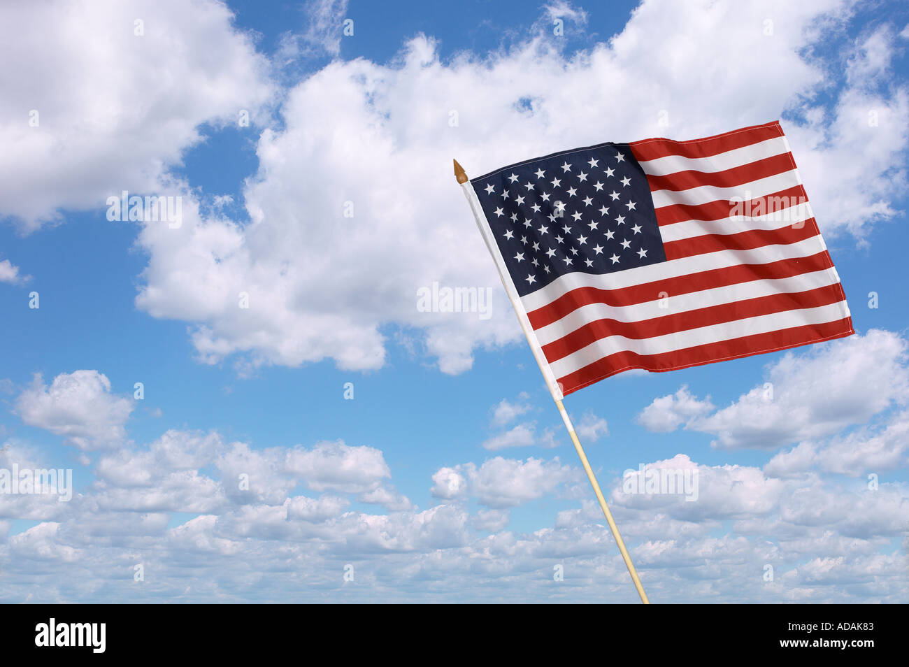 American flag with sunny blue sky Stock Photo