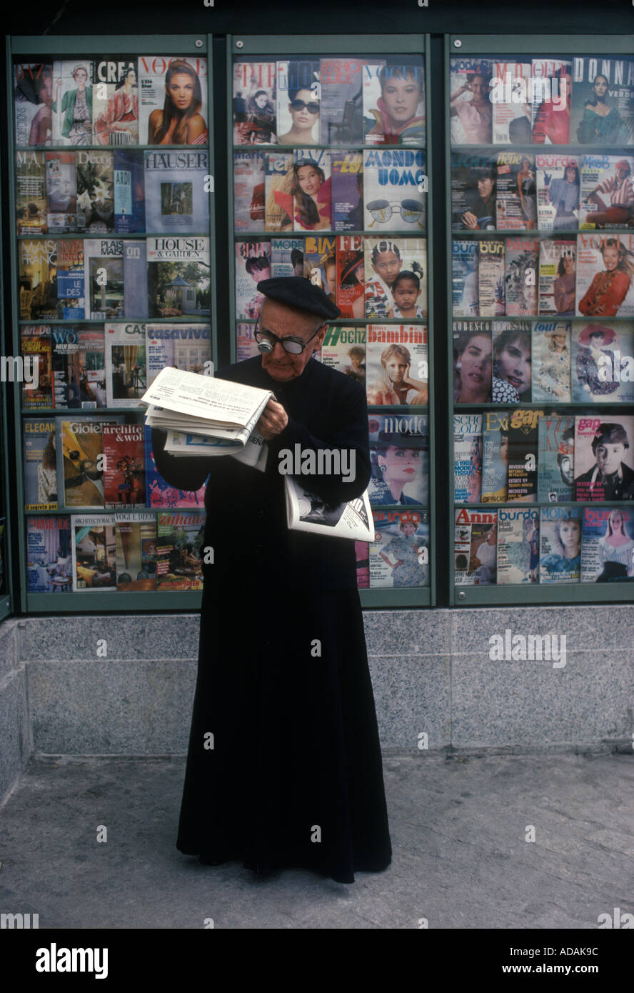 Long sighted priest reading a newspaper in Madrid Spain HOMER SYKES Stock Photo