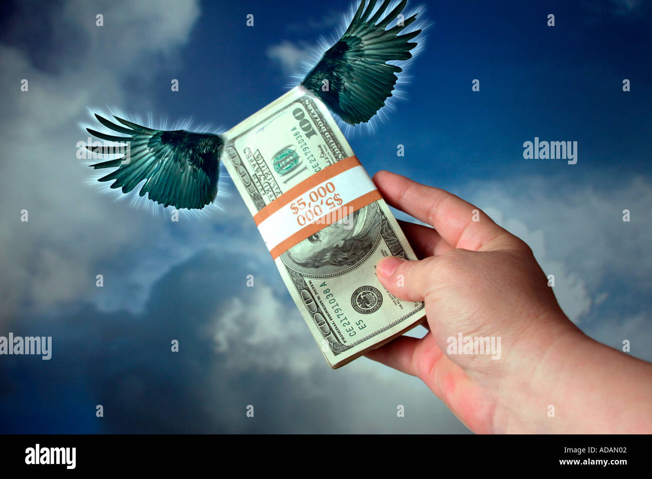 Loosing Money Flying Away Cash Concept Money with Wings Stock