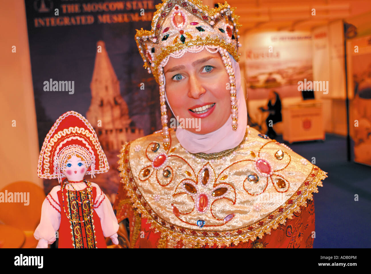 Woman in traditional russian costume and doll representing the Museum of Moscow,  International Tourism Fair BTL 2007 Lisbon Stock Photo