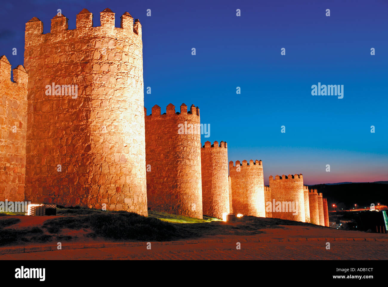Medieval city walls of Worldheritage town Avila by night, Castilla-Leon, Spain Stock Photo