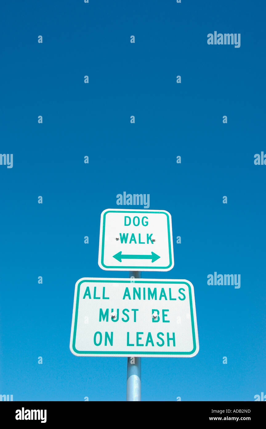 Dog Walk sign where pets dogs must be on leash by law Stock Photo Alamy