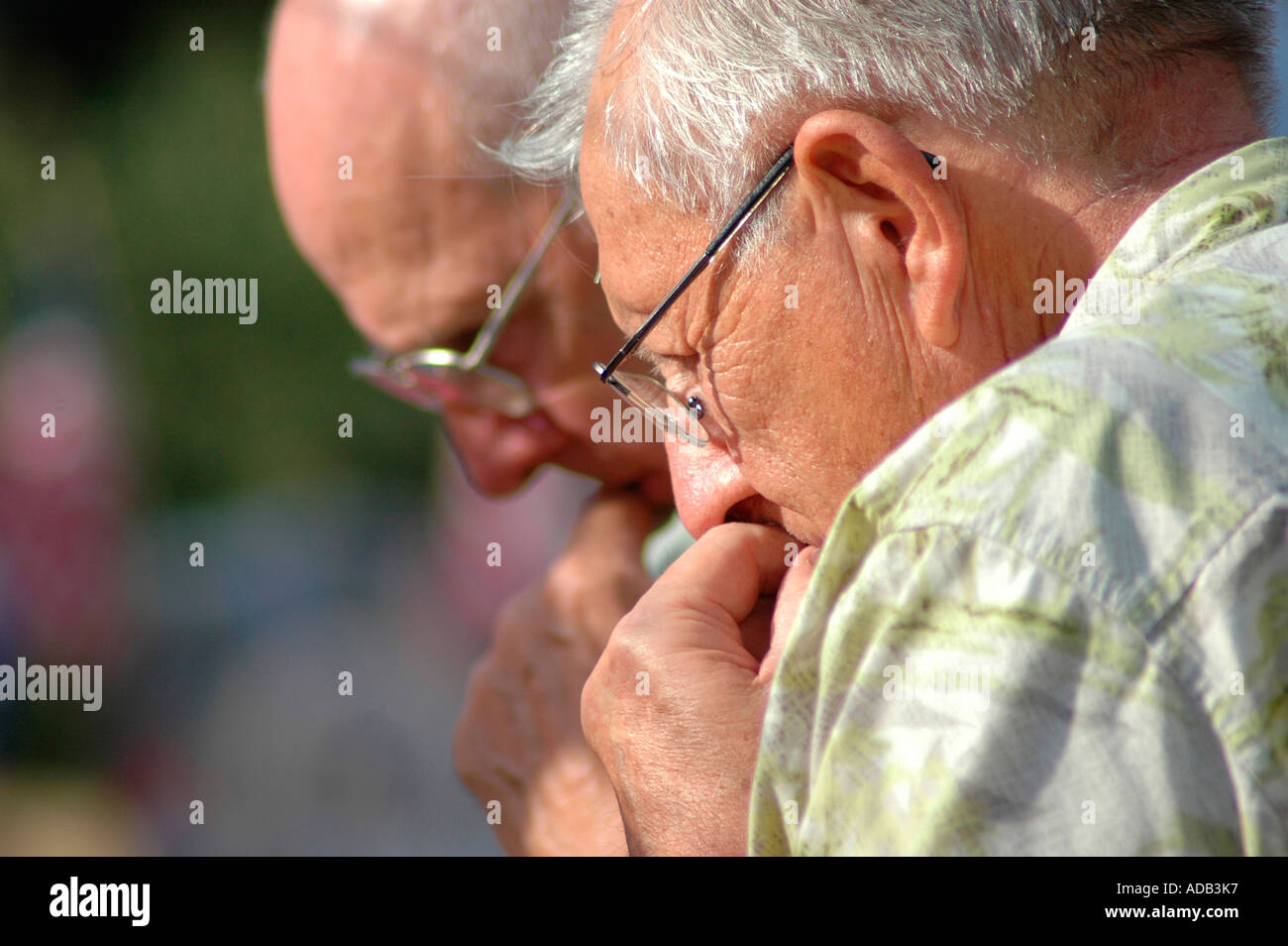 Friends and senior family members grieving at memorial for 14 Marines Killed in Iraq by IED all from Ohio reserve unit in Brook Park Ohio Older people Stock Photo