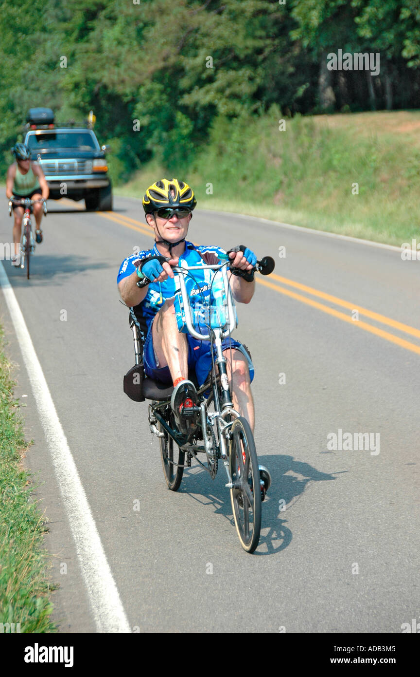 Bicycle riders in full safety gear riding the real public highways of ...