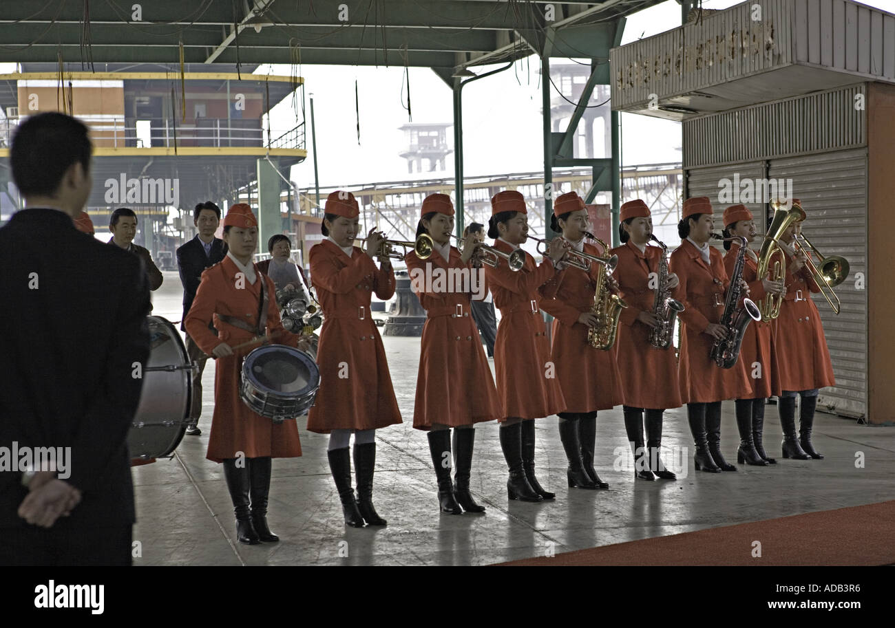 CHINA CHONGQING Female brass band greets passengers as the board a Chinese Cruise ship Stock Photo
