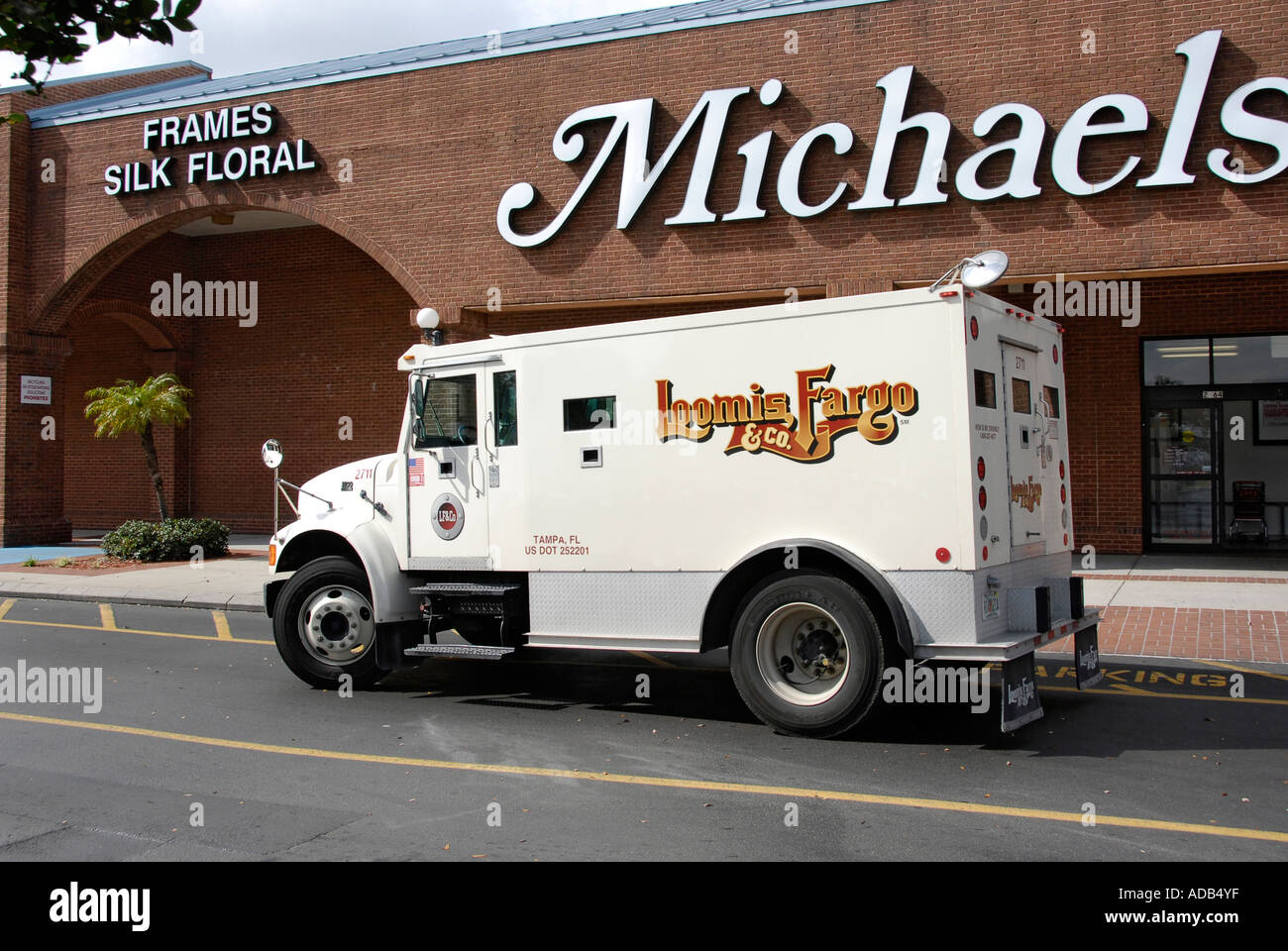Armored truck picks up and delivers cash money to banks and businesses