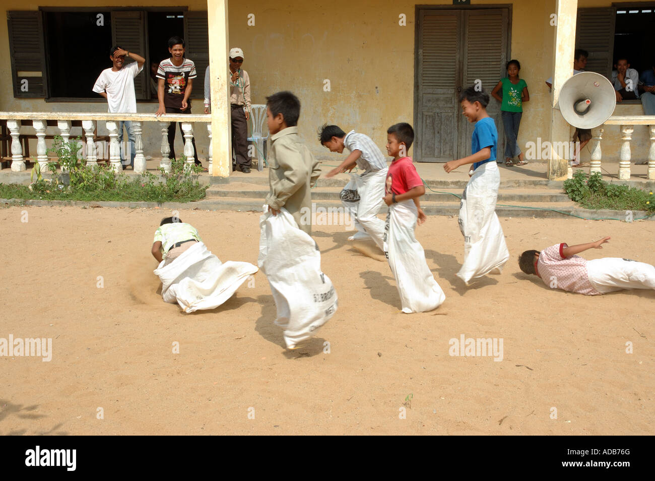 Children in a sack race at a school in Kampot, Cambodia Stock Photo