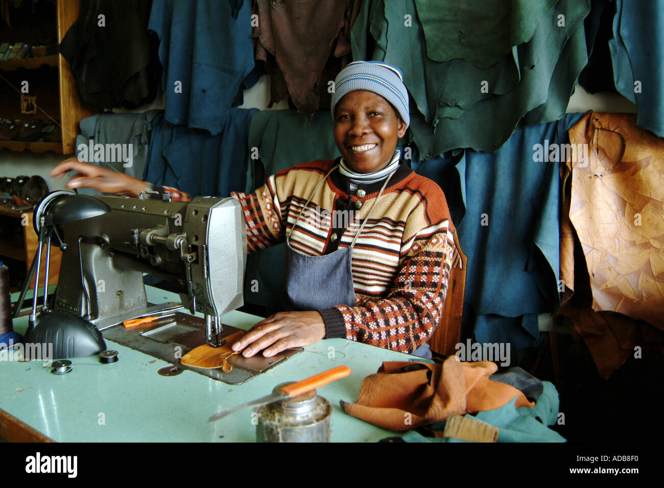 Henties Bay Namibia Southern Africa Leather Worker uses Sewing Machine Making Handbag Stock