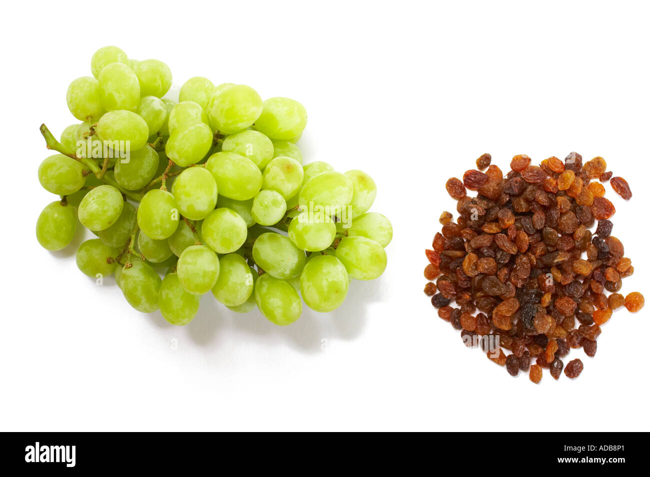 Bunch of grapes and sultanas on white background Stock Photo Alamy
