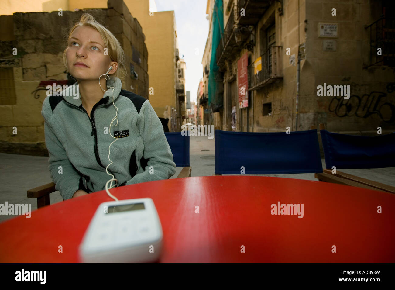 Blonde female listening to mp3 player Stock Photo