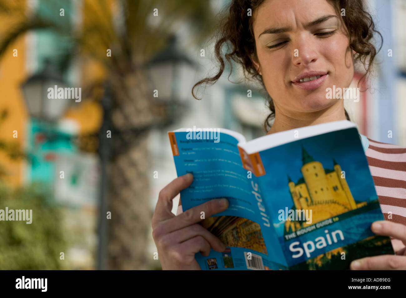 Female tourist reading Spanish guidebook Stock Photo Alamy