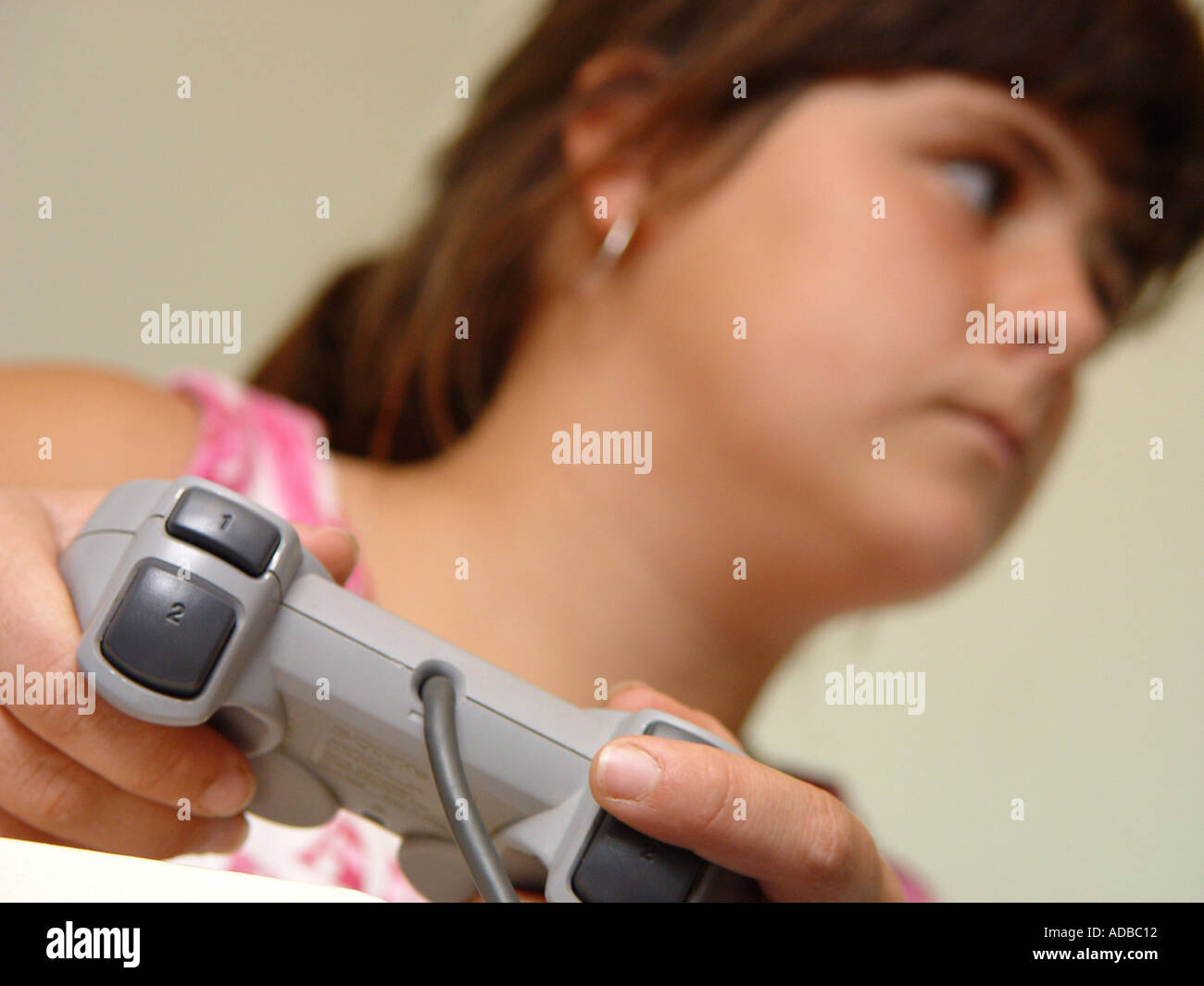 Girl playing a playstation game South Wales GB UK 2003 Stock Photo