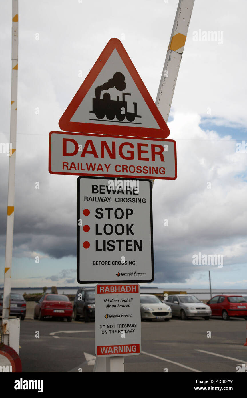 Warning Signs On Railway Level Crossing Pedestrian Area Of Wexford Harbour Town Centre With Barrier Up Leading To Car Park Stock Photo Alamy