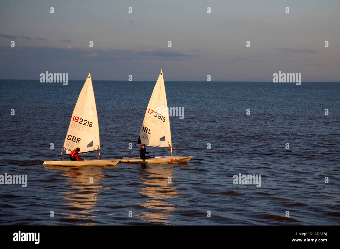 two laser class sailing boats from gbr and IRL great britain and