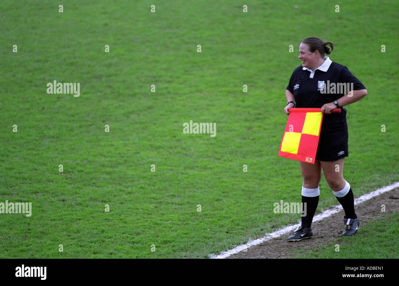 Referee's assitant running the line at a football match in Harwich