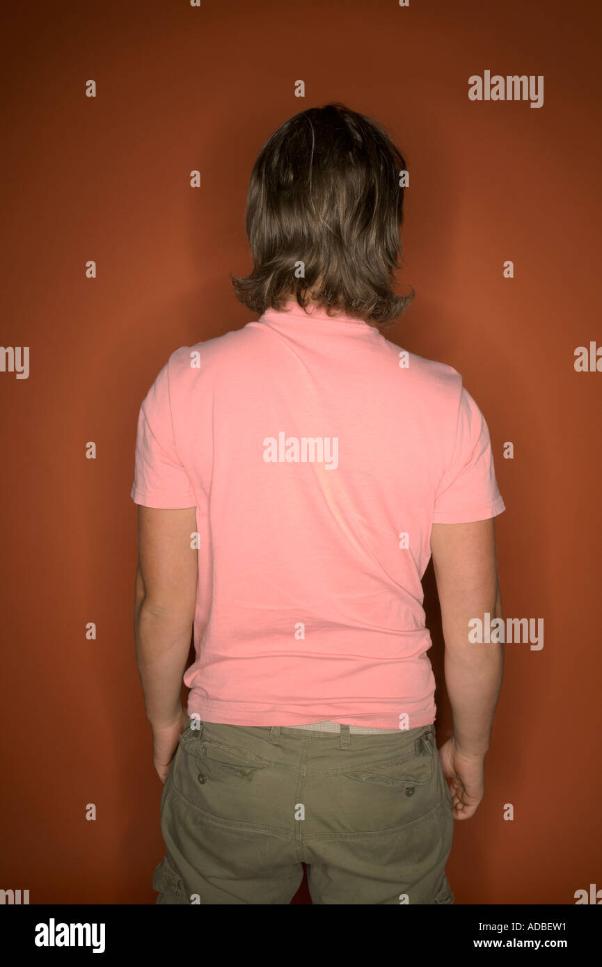 image of young man pulling off his shirt Stock Photo Alamy
