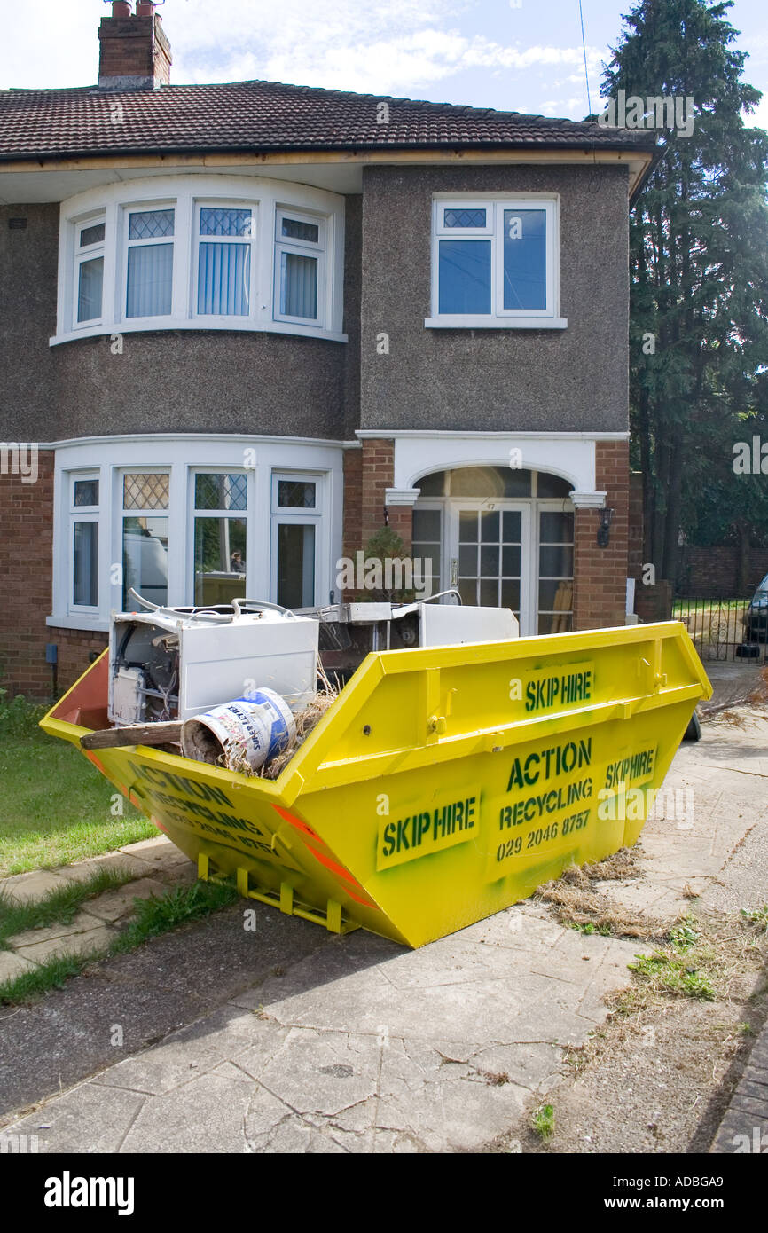 Skip outside residential house Cardiff Wales UK Stock Photo